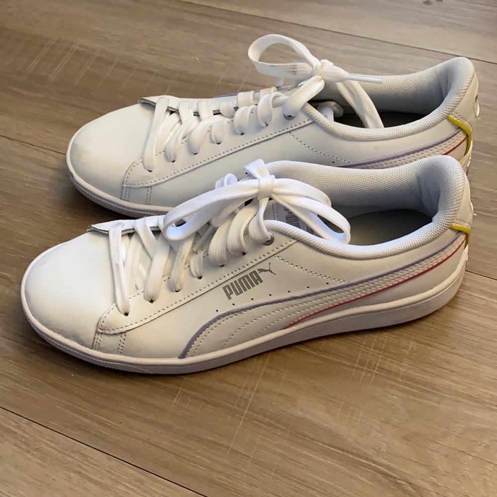 White Women’s Puma Shoes with Colorful Stripes.